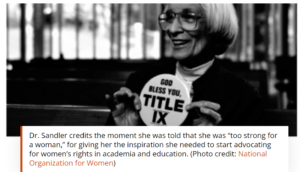 Dr. Sandler holding button saying "God Bless You Title IX:
